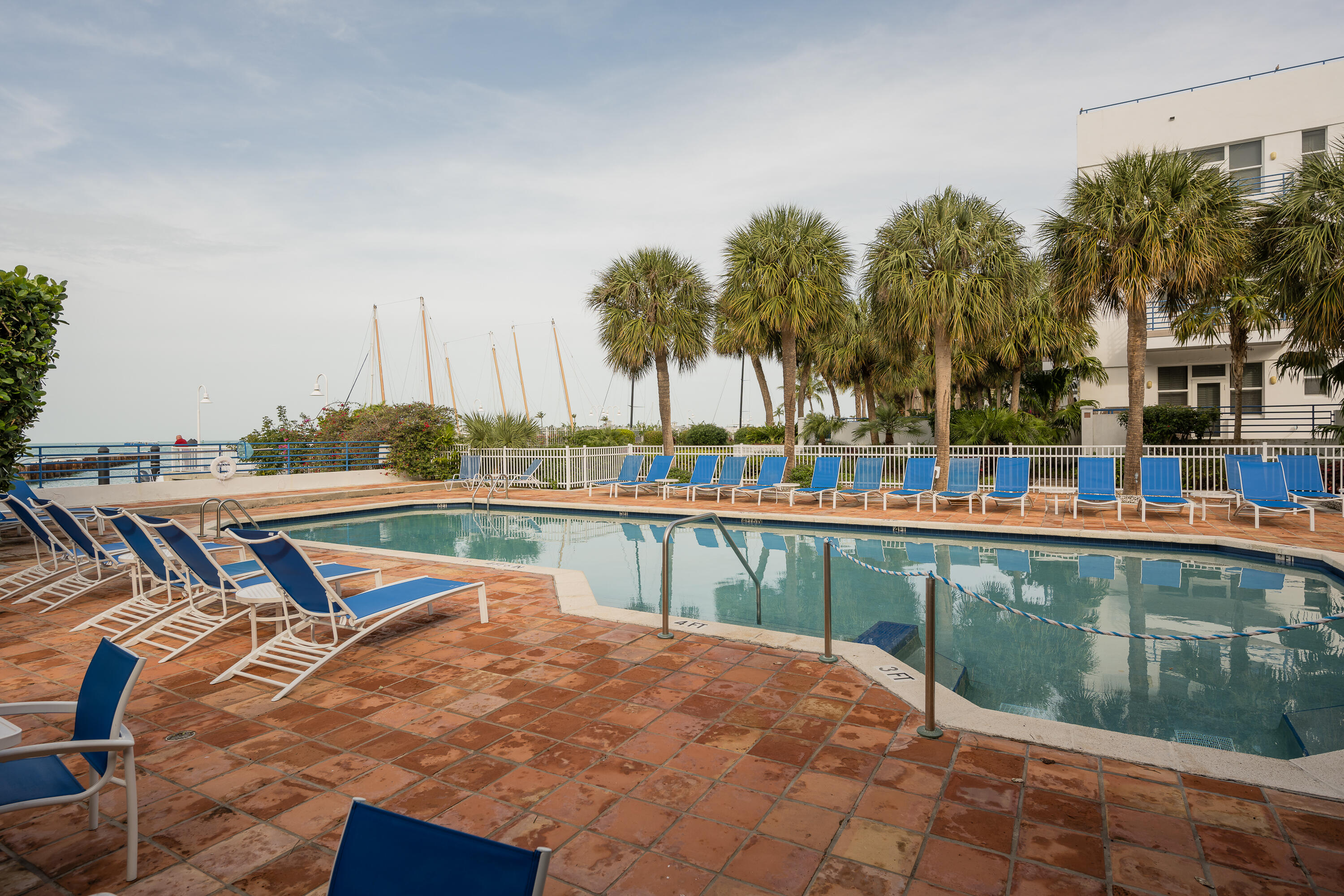 105 Front Street, Unit 122 Key West, FL 33040 - Photo 51 of 52 a view of a swimming pool with a lounge chairs