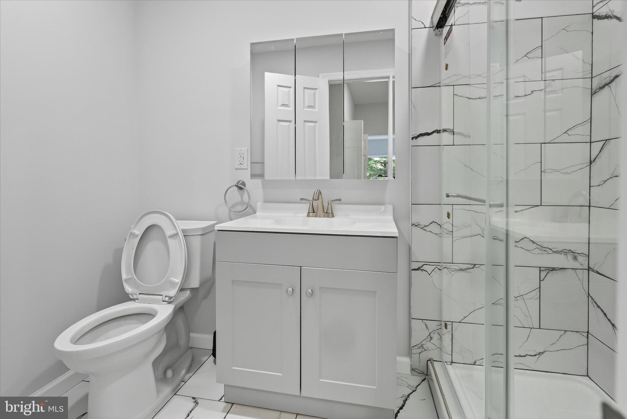 509 Lumberton Road, Unit 1 Hainesport, NJ 08036 - Photo 21 of 33 a bathroom with a sink toilet and shower