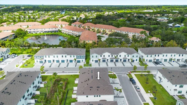 an aerial view of a city with lawn chairs