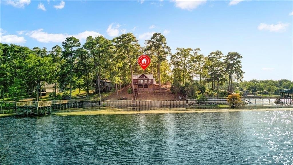 500 Two Coves Hemphill, TX 75948 - Photo 1 of 36 a view of a water fountain and a big yard