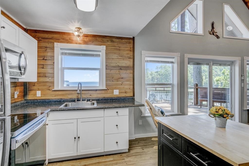 500 Two Coves Hemphill, TX 75948 - Photo 11 of 36 a kitchen with a sink stove and cabinets