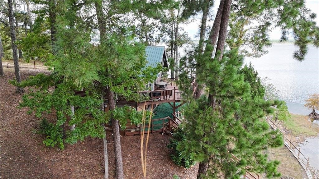 500 Two Coves Hemphill, TX 75948 - Photo 26 of 36 a view of a house with a tree
