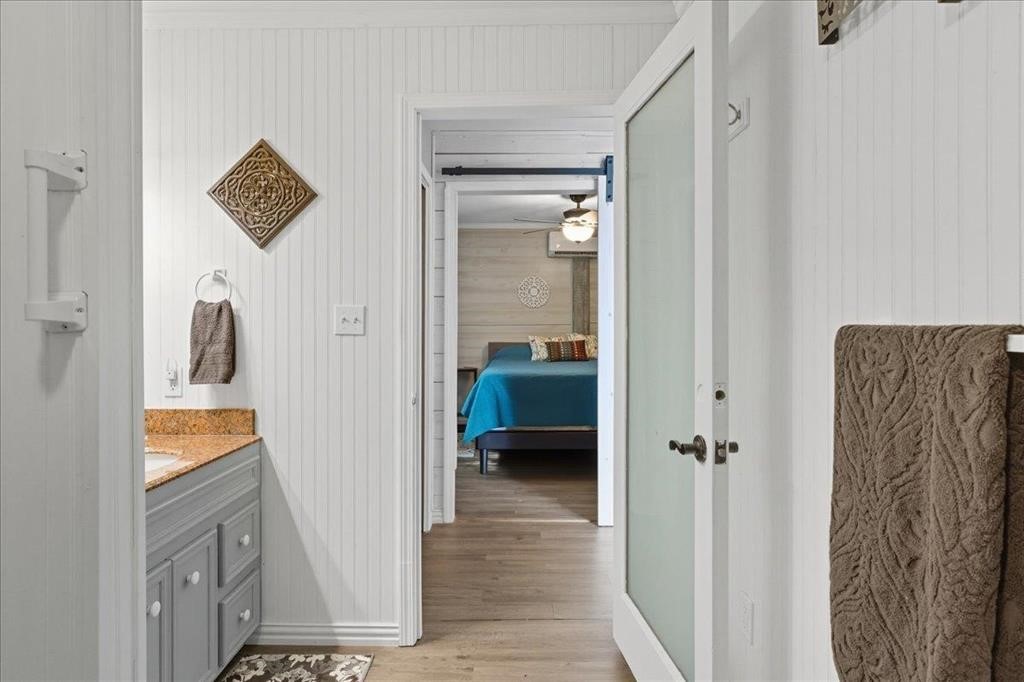500 Two Coves Hemphill, TX 75948 - Photo 33 of 36 a view of a hallway with wooden floor and closet