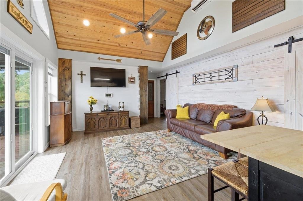 500 Two Coves Hemphill, TX 75948 - Photo 36 of 36 a living room with furniture and a flat screen tv