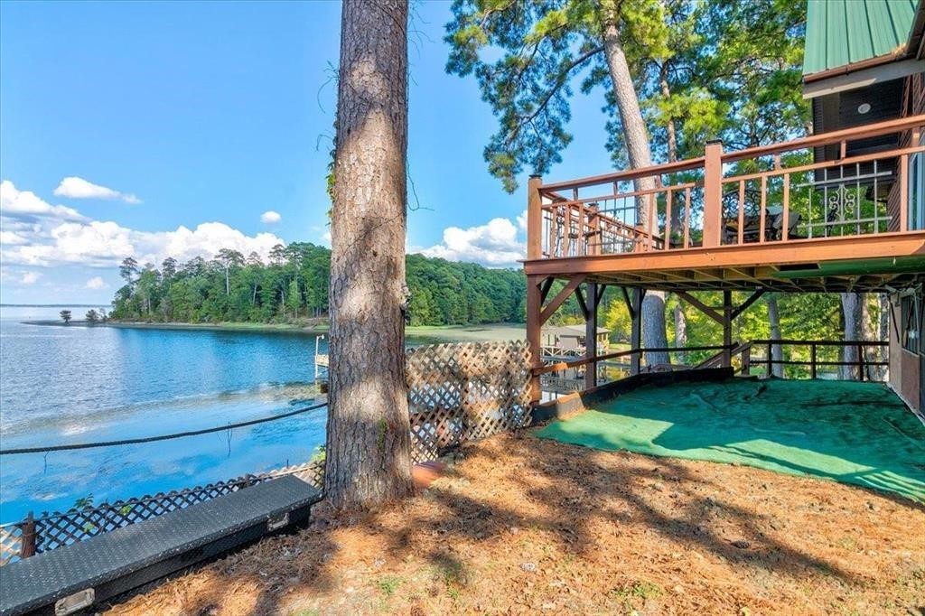 500 Two Coves Hemphill, TX 75948 - Photo 5 of 36 a view of a wooden deck with a yard