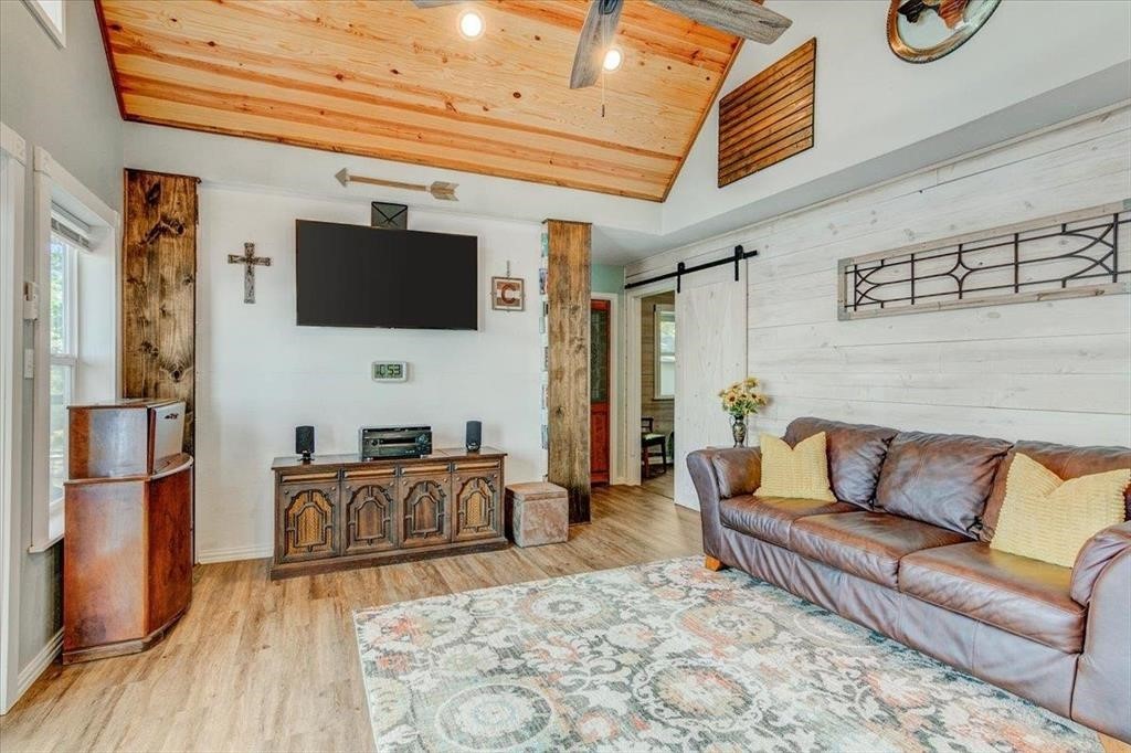 500 Two Coves Hemphill, TX 75948 - Photo 9 of 36 a living room with furniture and a flat screen tv