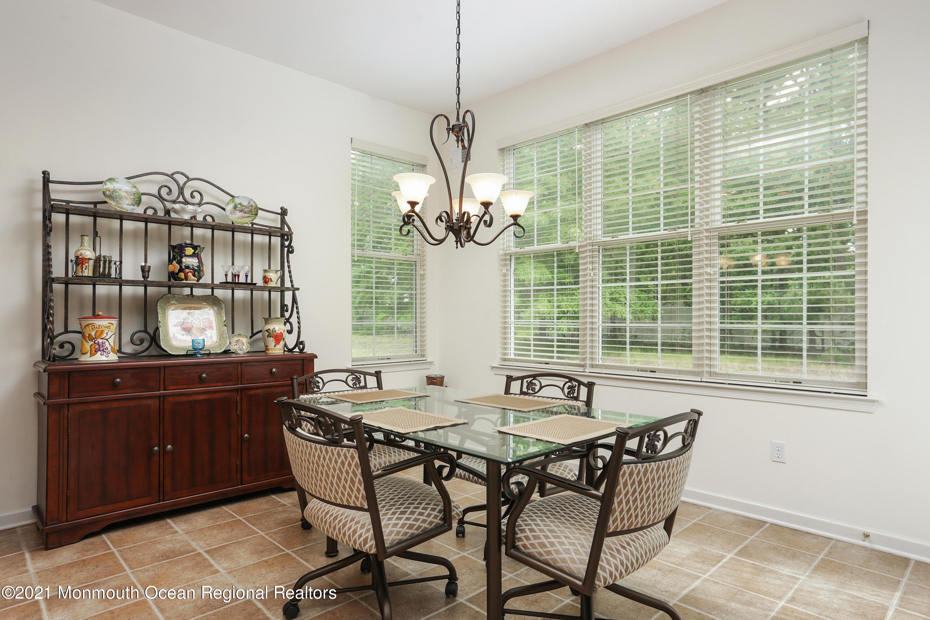 21 Crooked Stick Road Jackson, NJ 08527 - Photo 16 of 37 a view of a dining room with furniture window and outside view