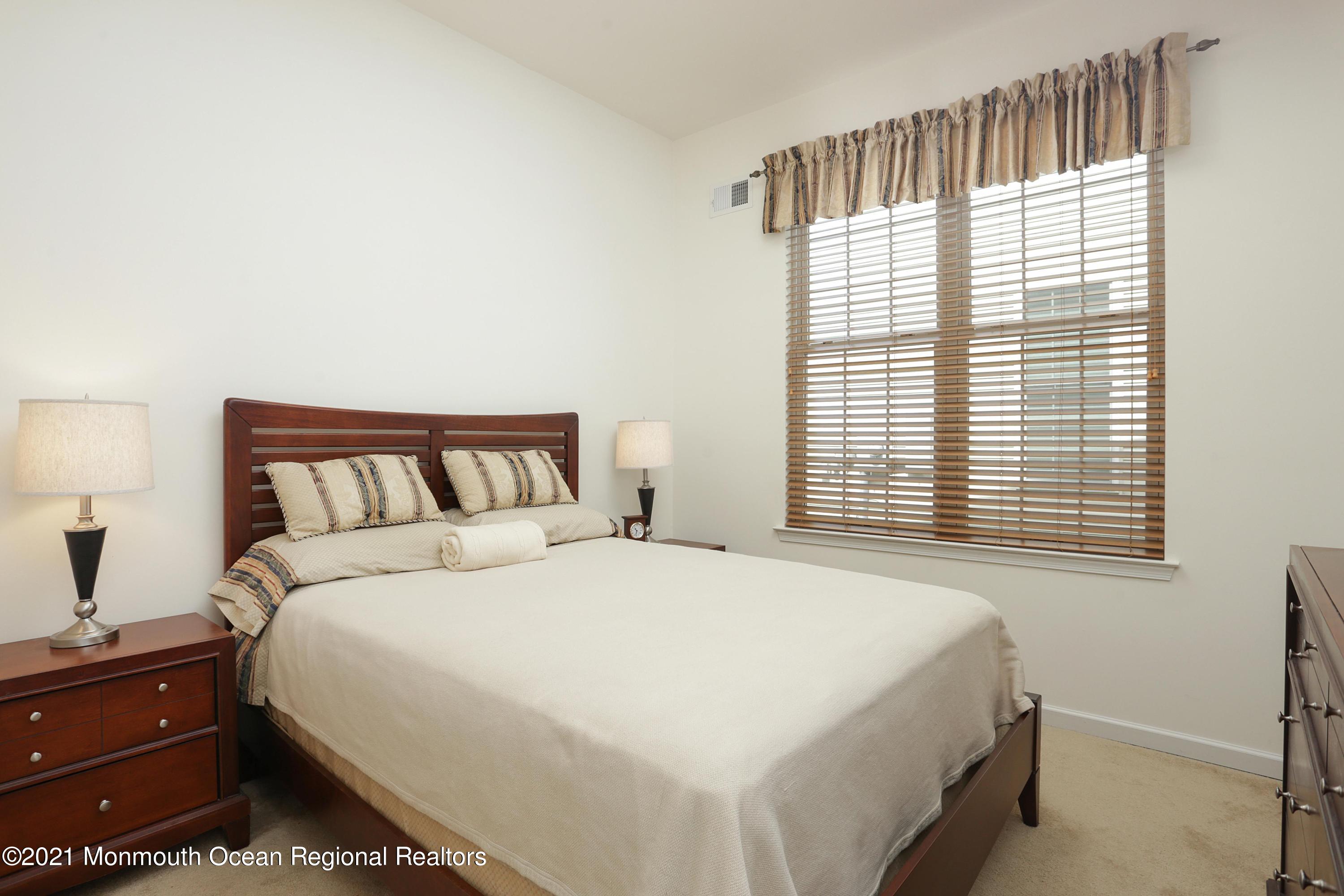 21 Crooked Stick Road Jackson, NJ 08527 - Photo 20 of 37 a bedroom with a bed and a window
