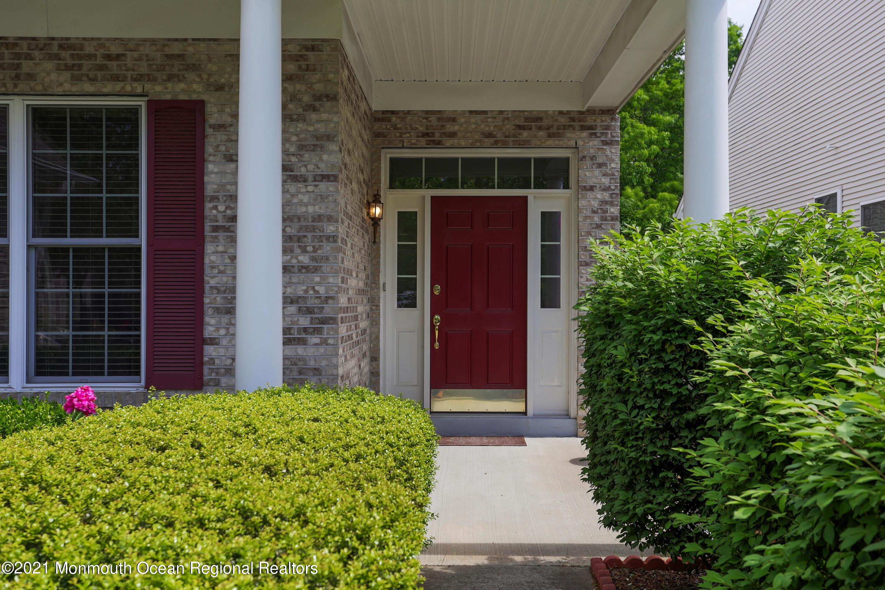 21 Crooked Stick Road Jackson, NJ 08527 - Photo 3 of 37 a front view of a house with a yard
