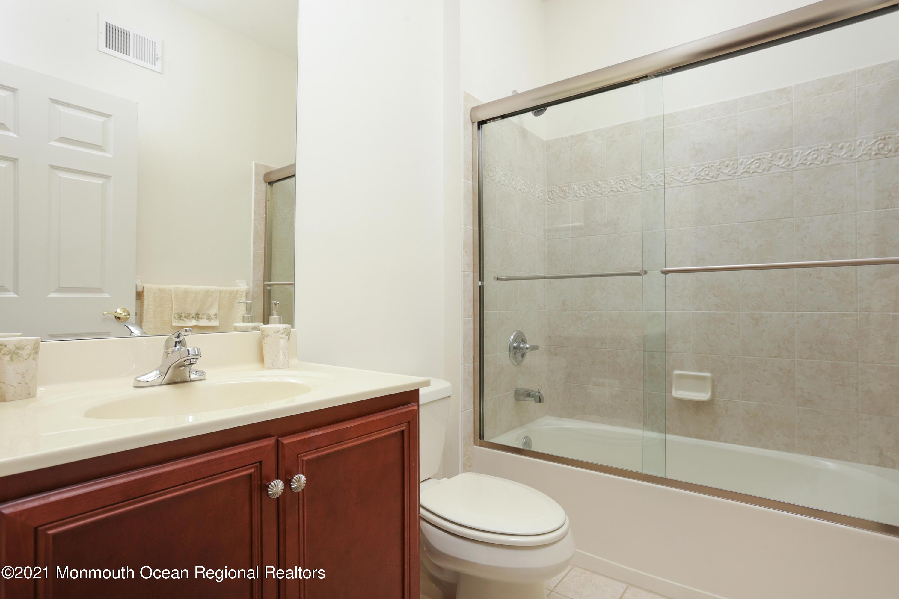 21 Crooked Stick Road Jackson, NJ 08527 - Photo 21 of 37 a bathroom with a sink a toilet and shower