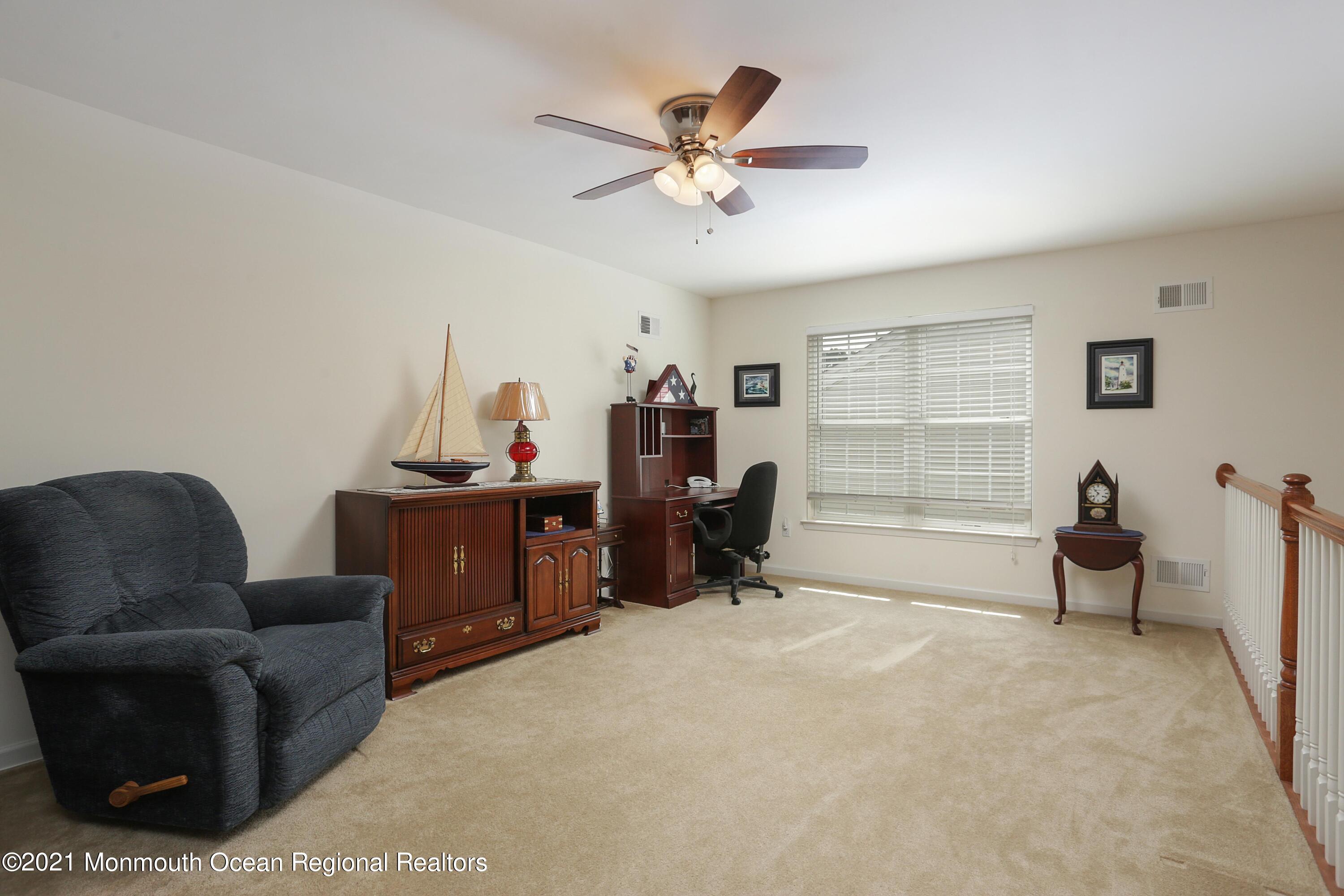 21 Crooked Stick Road Jackson, NJ 08527 - Photo 24 of 37 a work room with furniture and a ceiling fan