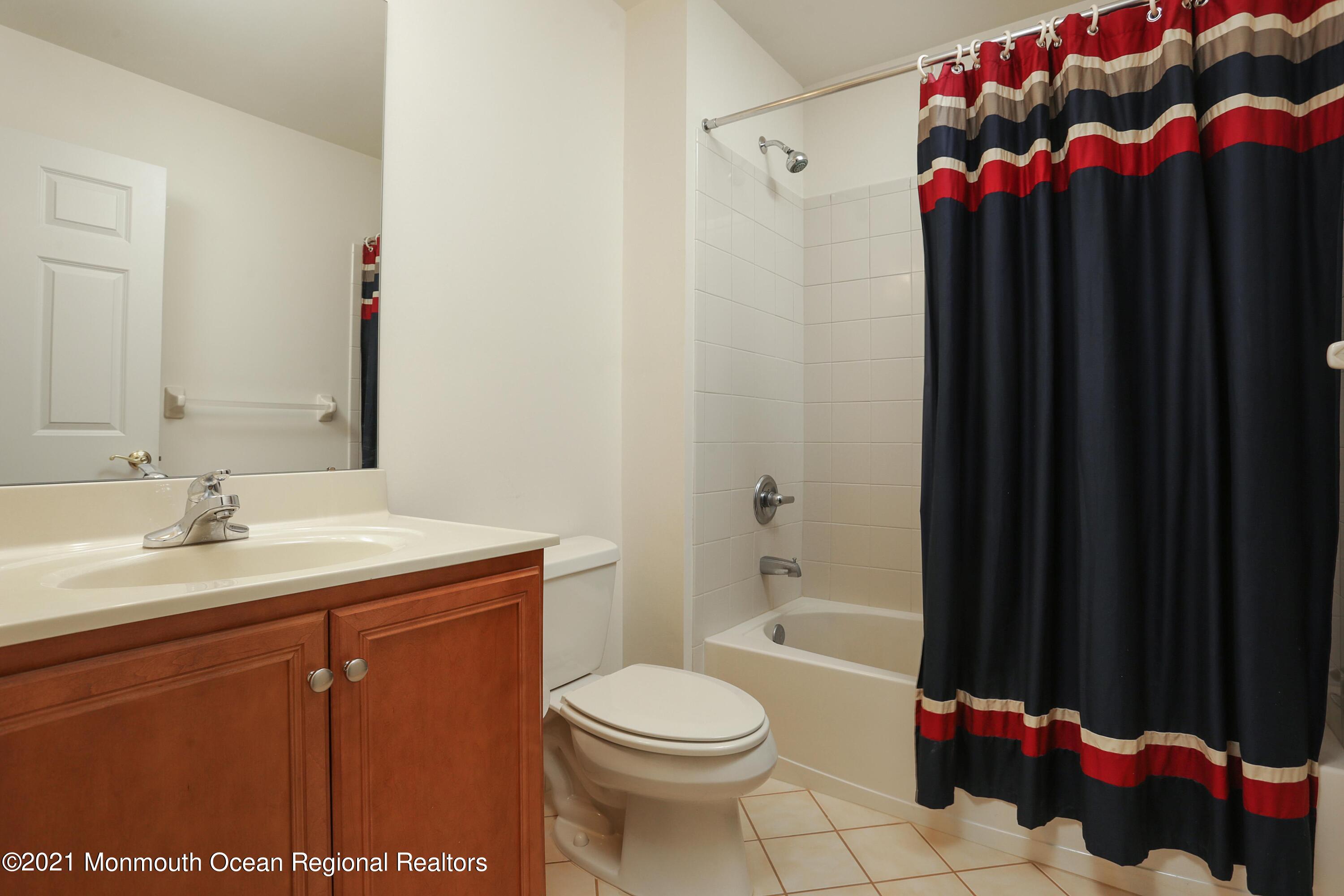 21 Crooked Stick Road Jackson, NJ 08527 - Photo 25 of 37 a bathroom with a sink a toilet and shower