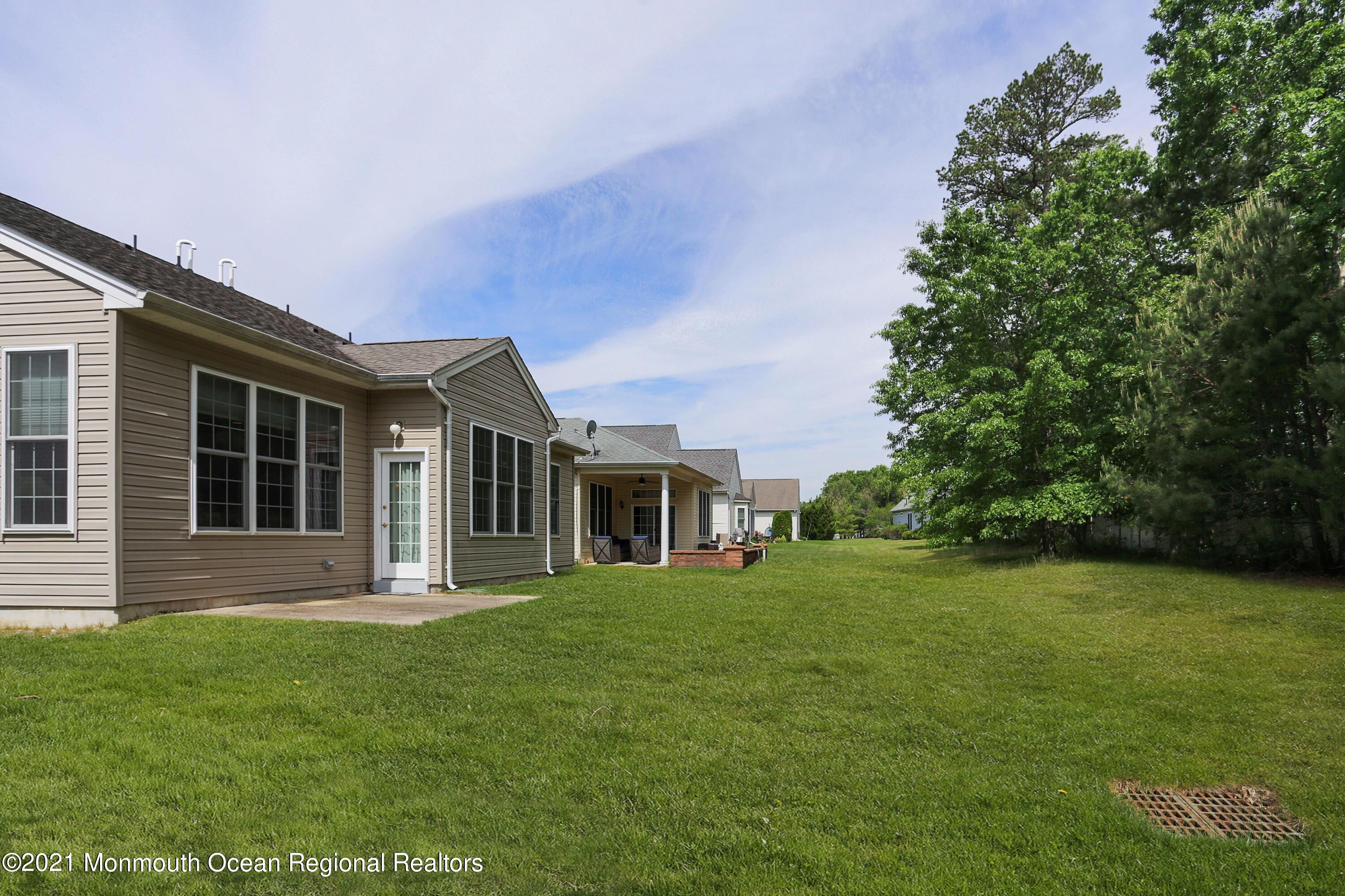 21 Crooked Stick Road Jackson, NJ 08527 - Photo 29 of 37 a front view of a house with a garden