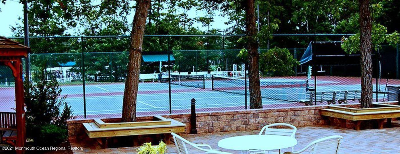 21 Crooked Stick Road Jackson, NJ 08527 - Photo 34 of 37 a view of a swimming pool with a patio