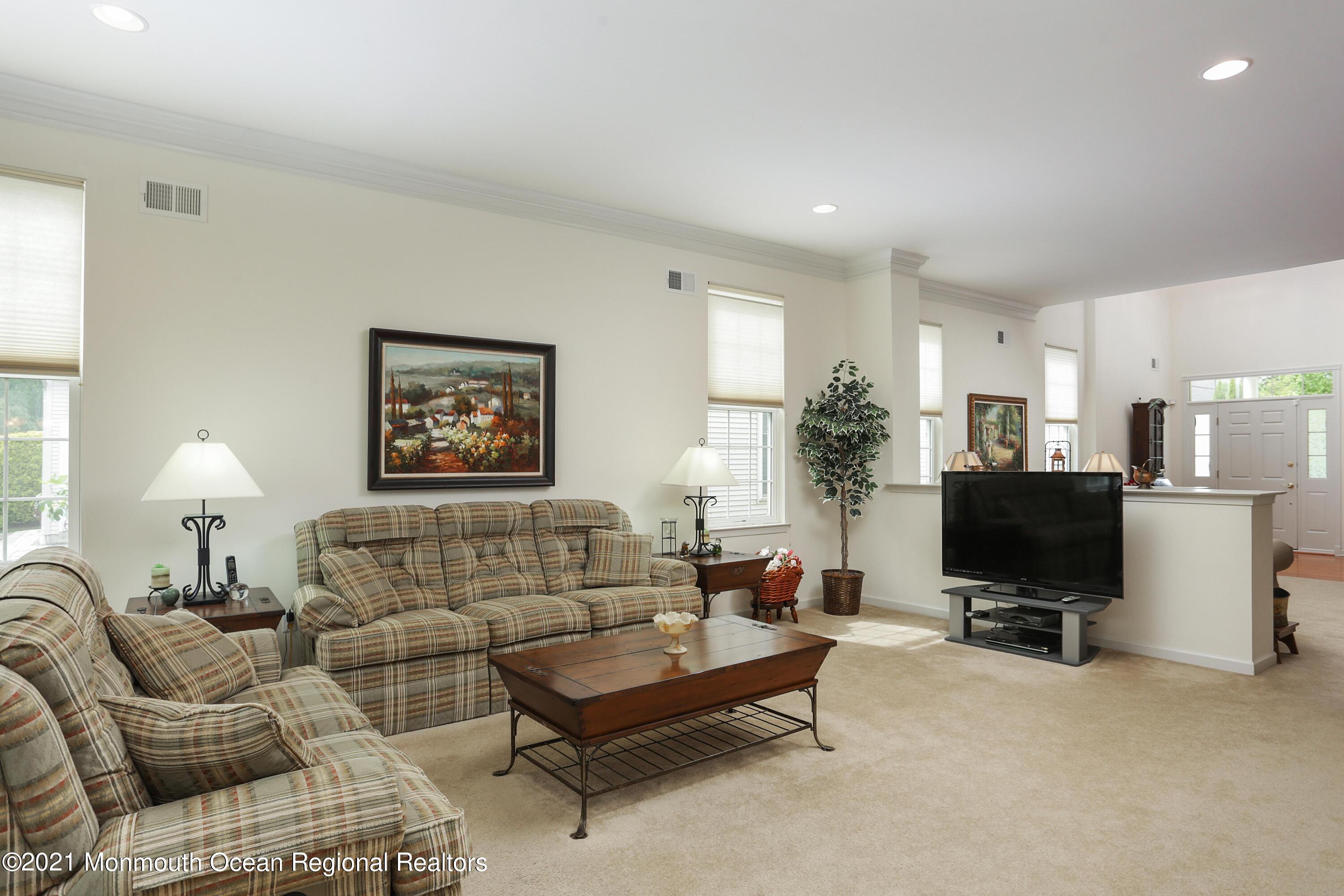 21 Crooked Stick Road Jackson, NJ 08527 - Photo 7 of 37 a living room with furniture and a flat screen tv