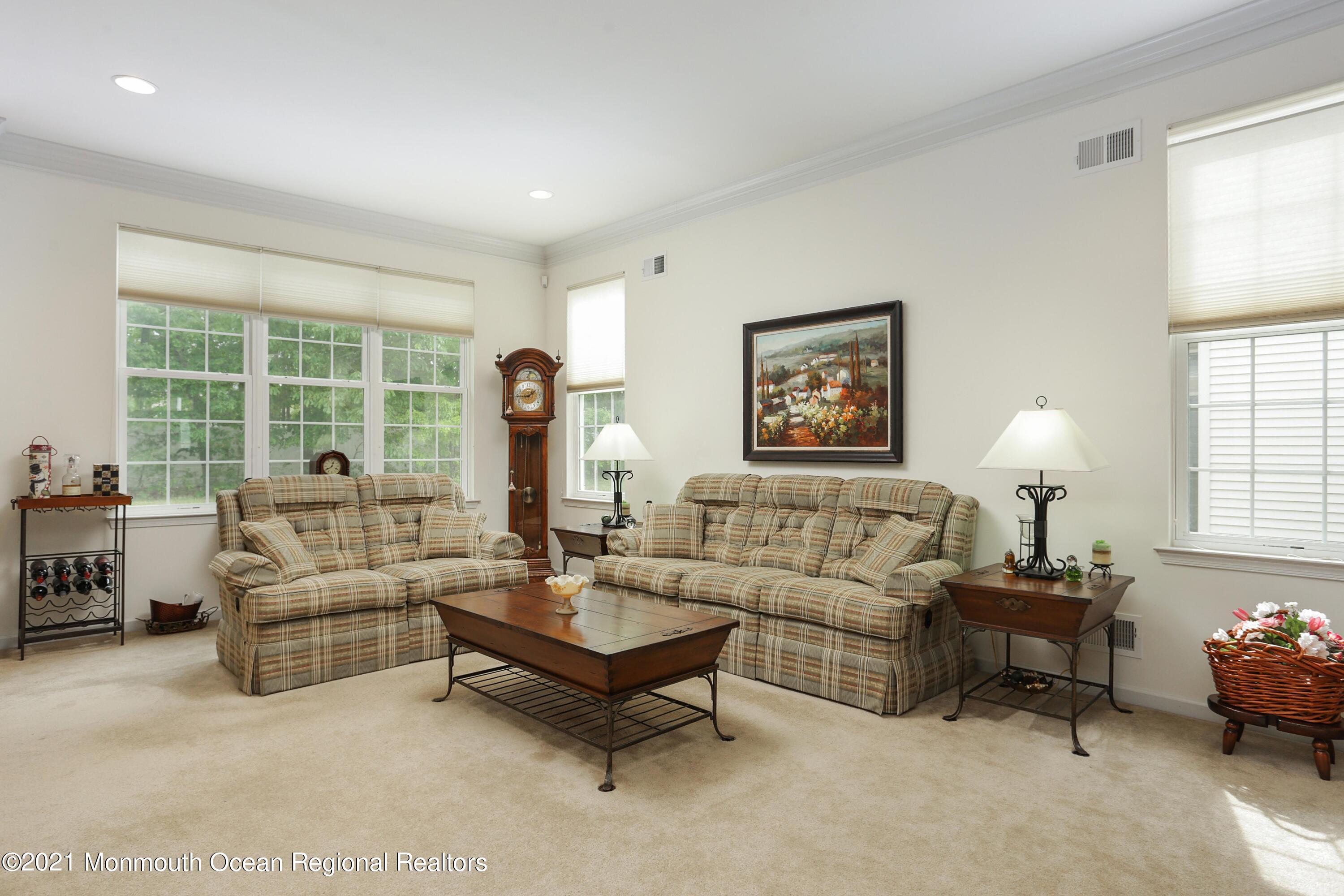 21 Crooked Stick Road Jackson, NJ 08527 - Photo 8 of 37 a living room with furniture and a large window