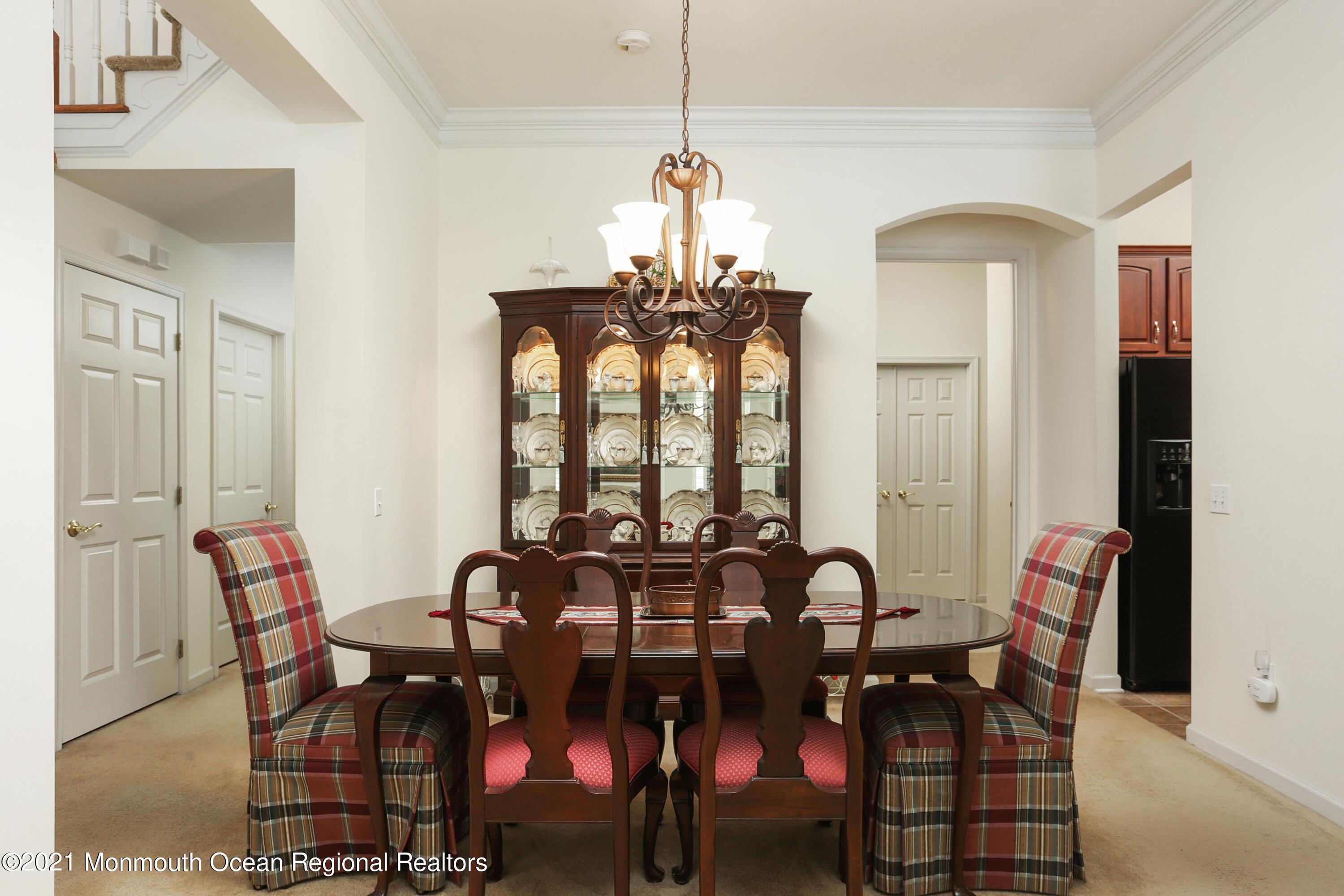21 Crooked Stick Road Jackson, NJ 08527 - Photo 10 of 37 a view of a dining room with furniture and chandelier
