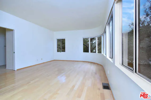 a view of a bedroom with windows