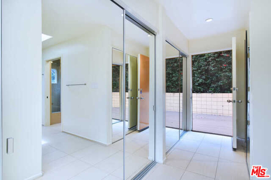 10045 Reevesbury Drive Beverly Hills, CA 90210 - Photo 17 of 32 a bathroom with a tub and shower