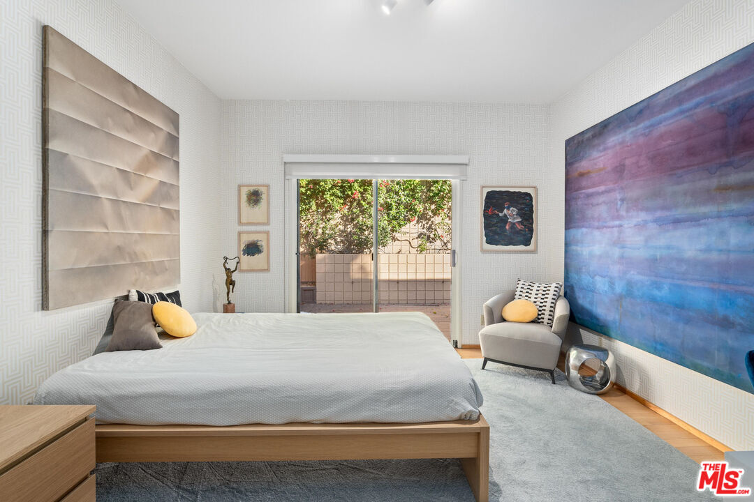 10045 Reevesbury Drive Beverly Hills, CA 90210 - Photo 20 of 32 a bedroom with a bed and window