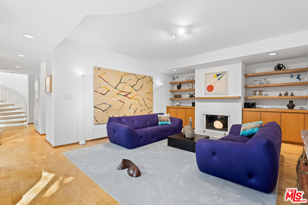 10045 Reevesbury Drive Beverly Hills, CA 90210 - Photo 2 of 32 a living room with furniture and a fireplace