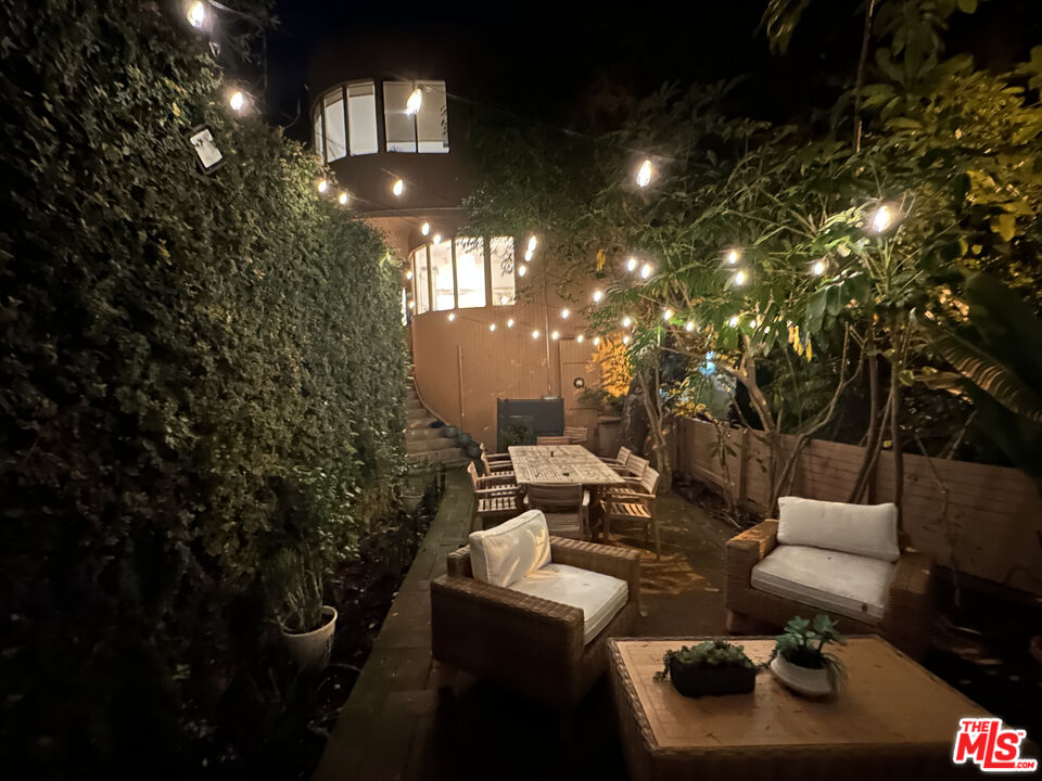 10045 Reevesbury Drive Beverly Hills, CA 90210 - Photo 32 of 32 a living room with couches and a potted plant