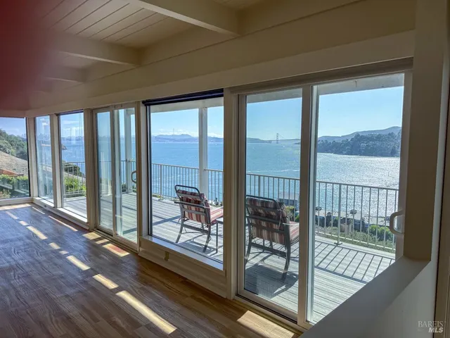 a kitchen with granite countertop a sink a stove and cabinets