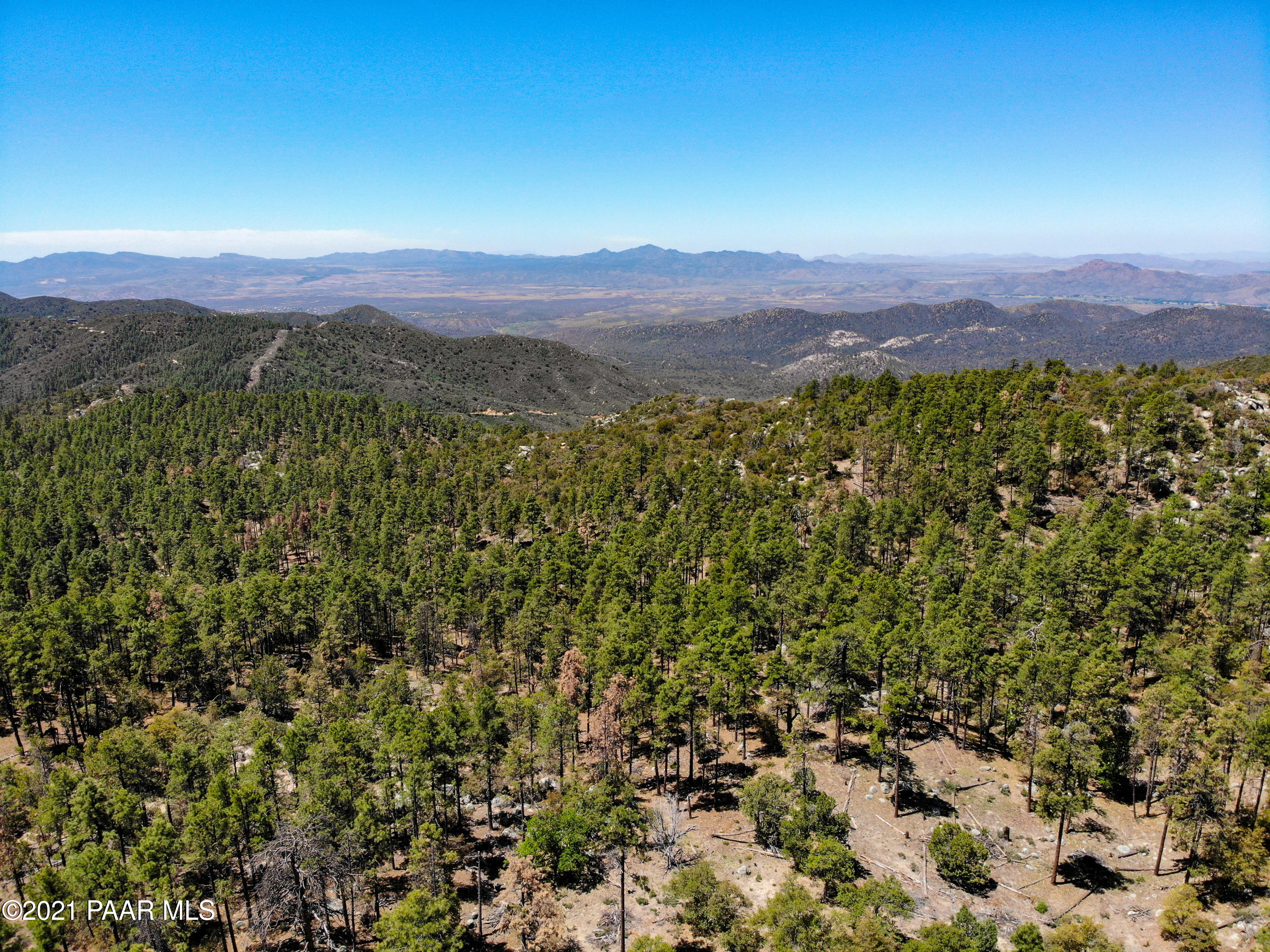 5000 West Copper Basin Road Prescott, AZ 86303 - Photo 11 of 15 a view of a lush green hillside and a building