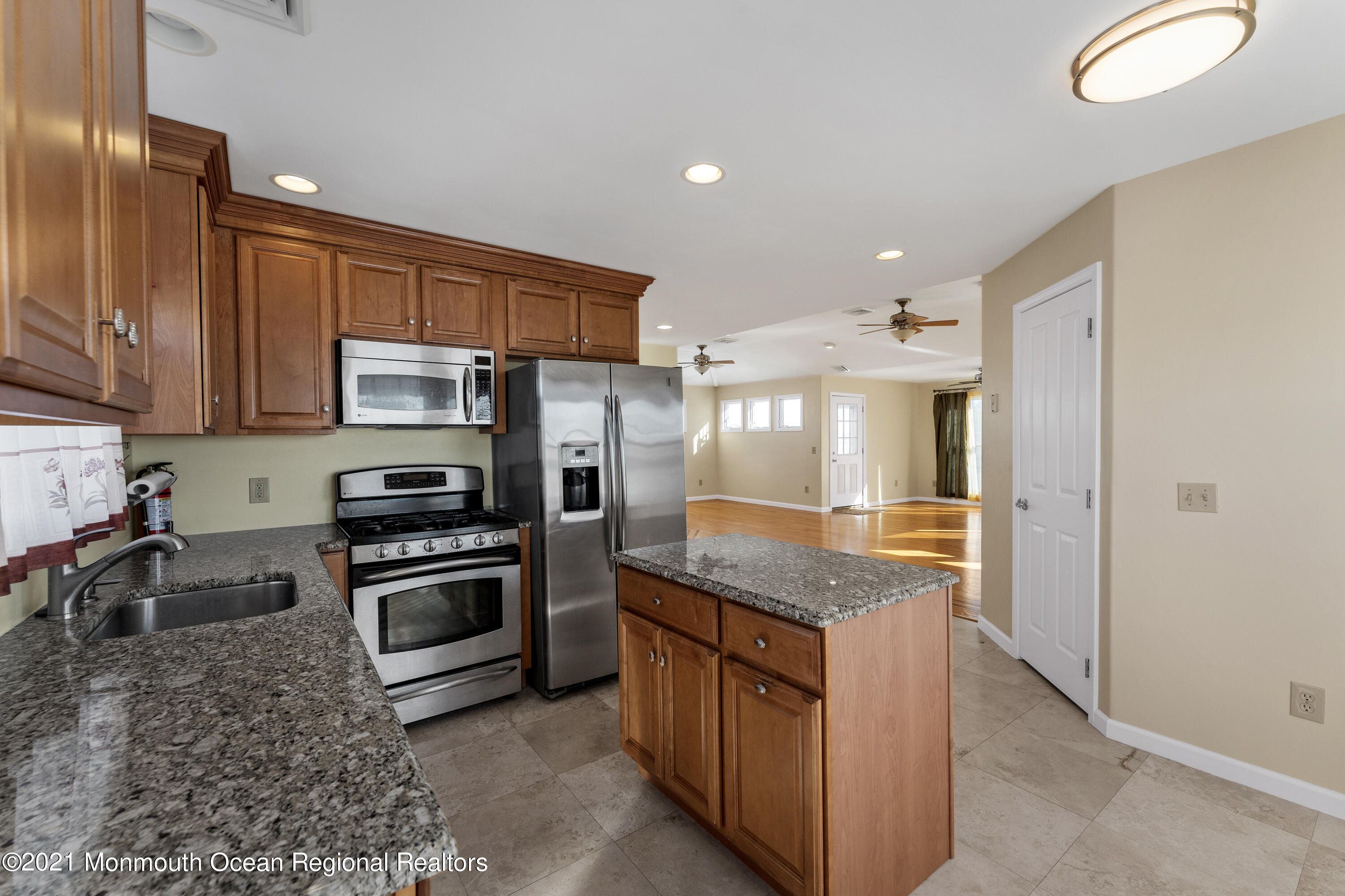 303 Heron Road Tuckerton, NJ 08087 - Photo 22 of 58 a kitchen with stainless steel appliances granite countertop a sink stove and refrigerator
