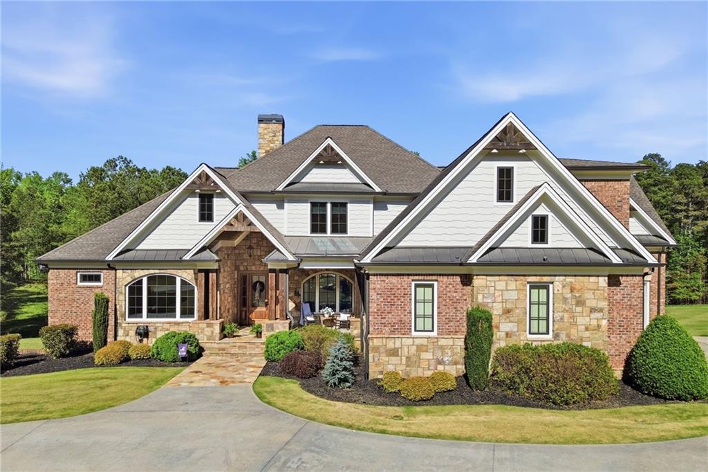 680 Gaddis Road Canton, GA 30115 - Photo 1 of 85 a front view of a house with garden