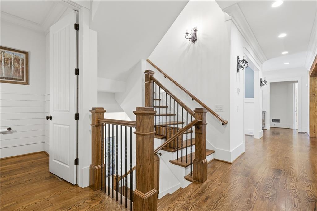 680 Gaddis Road Canton, GA 30115 - Photo 22 of 85 a view of a hallway with wooden floor and stairs