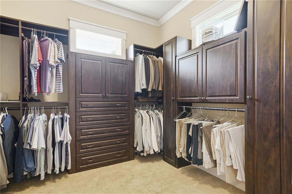680 Gaddis Road Canton, GA 30115 - Photo 29 of 85 a view of walk in closet with clothes and shoes