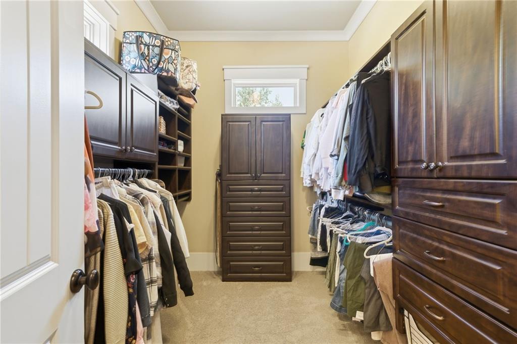 680 Gaddis Road Canton, GA 30115 - Photo 32 of 85 a view of walk in closet with clothes