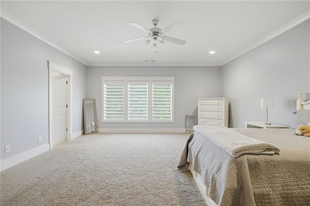 680 Gaddis Road Canton, GA 30115 - Photo 37 of 85 a bedroom with a bed and a ceiling fan