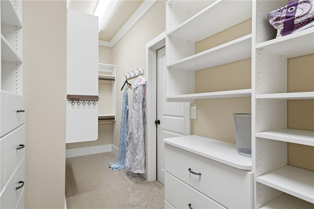 680 Gaddis Road Canton, GA 30115 - Photo 40 of 85 a view of walk in closet with clothes and shoes