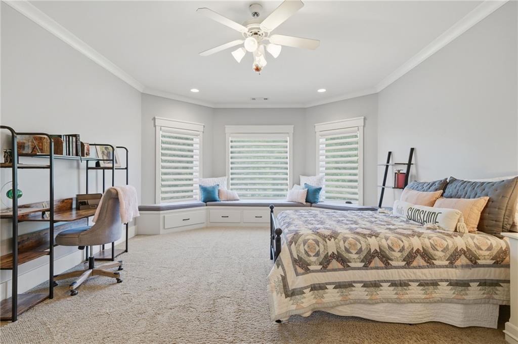 680 Gaddis Road Canton, GA 30115 - Photo 42 of 85 a bedroom with a bed and a chandelier
