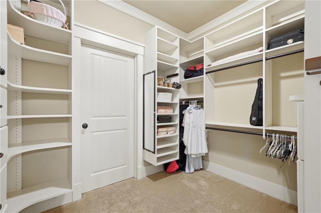 680 Gaddis Road Canton, GA 30115 - Photo 44 of 85 a view of walk in closet with empty racks