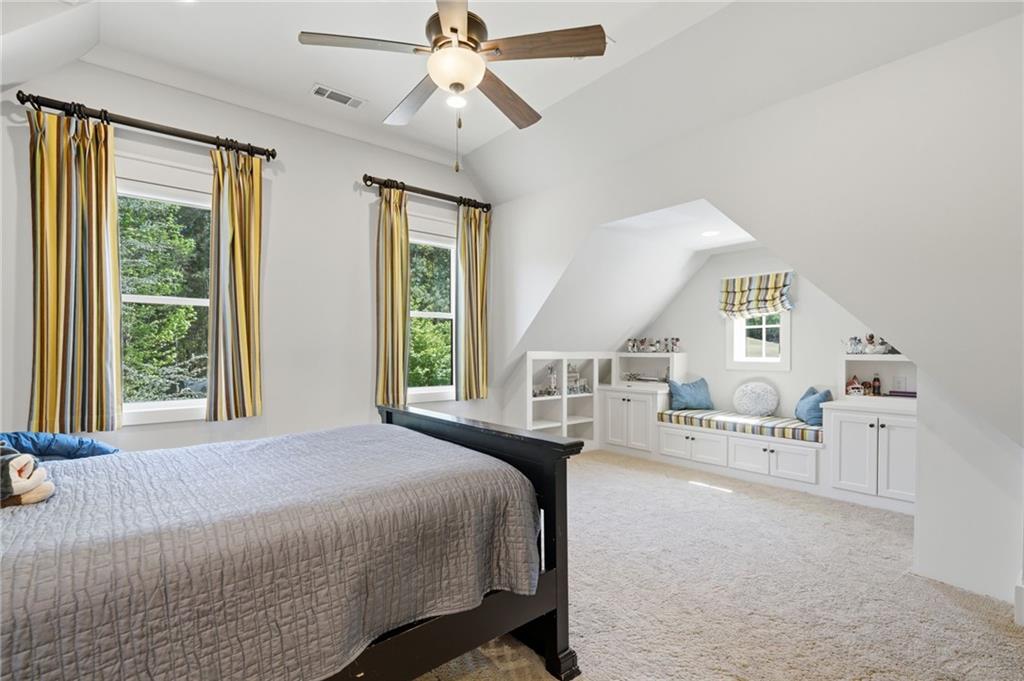 680 Gaddis Road Canton, GA 30115 - Photo 45 of 85 a bedroom with a bed furniture and a large window