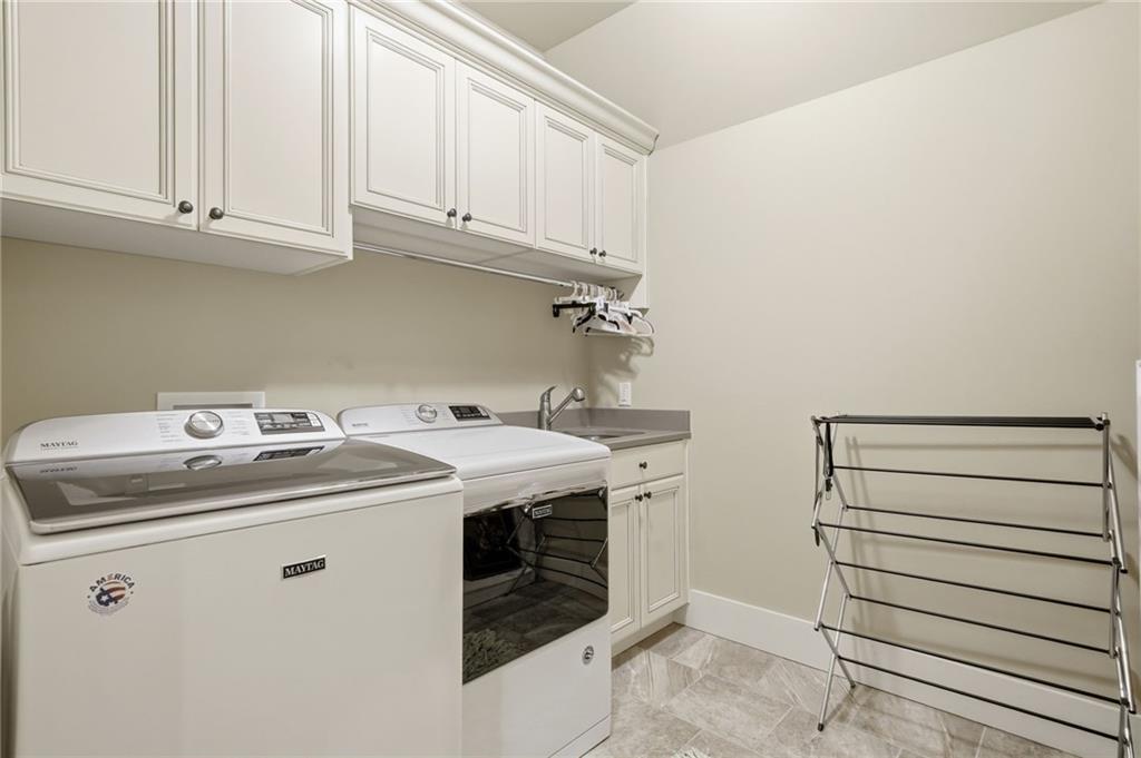 680 Gaddis Road Canton, GA 30115 - Photo 49 of 85 a utility room with dryer and washer