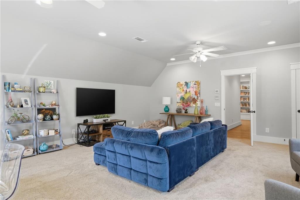 680 Gaddis Road Canton, GA 30115 - Photo 51 of 85 a living room with furniture and a flat screen tv