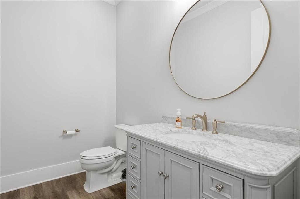 680 Gaddis Road Canton, GA 30115 - Photo 59 of 85 a bathroom with a granite countertop sink mirror vanity and toilet