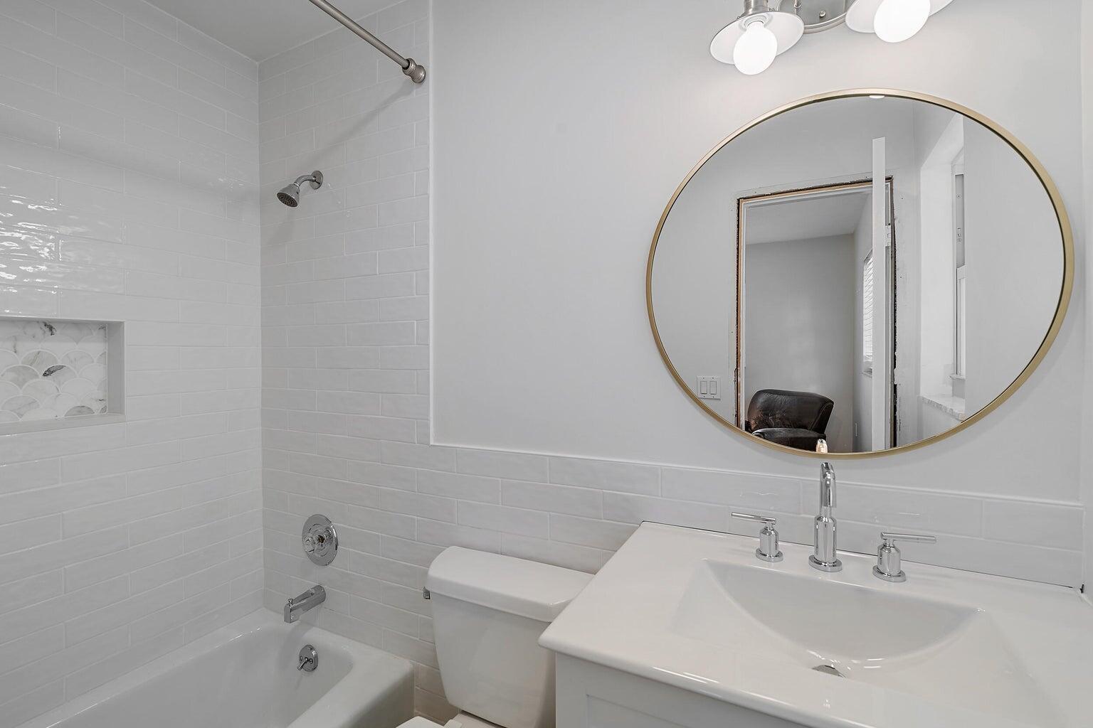 356 Mars Avenue Tequesta, FL 33469 - Photo 22 of 25 a bathroom with a sink a toilet and a mirror