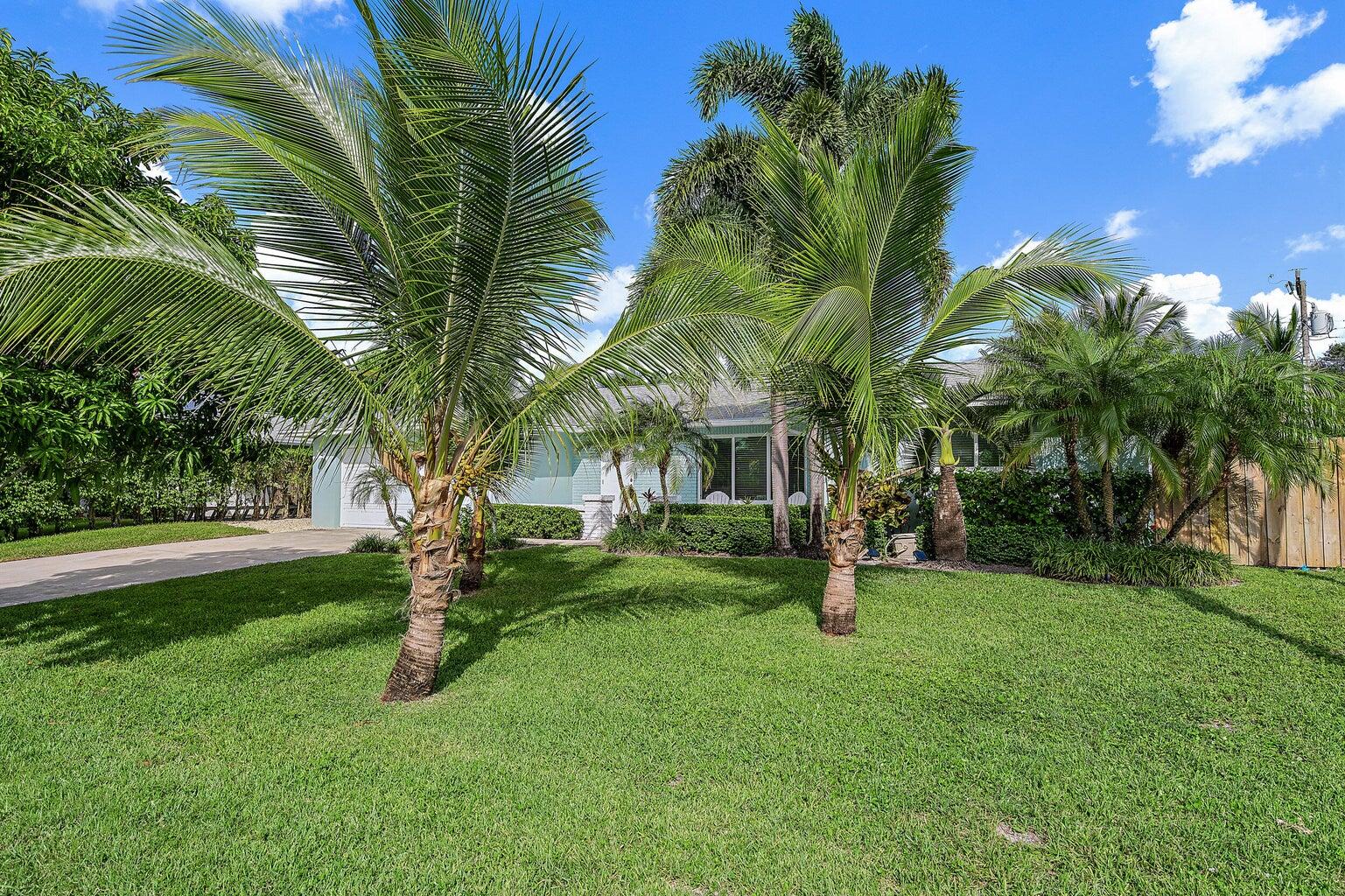 356 Mars Avenue Tequesta, FL 33469 - Photo 25 of 25 a front view of a house with garden