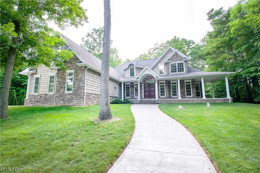 6868 River Styx Road Medina, OH 44256 - Photo 35 of 35 Fine craftsmanship and a well-designed floor plan come together in this gorgeous two-story home that has it all! Custom built-ins, hand-built beams, stone fireplaces, mudroom, natural ledge stone, & a great flow from room to room.