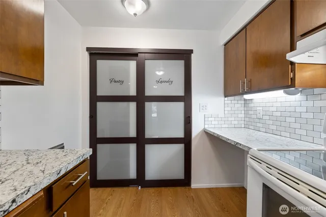 a kitchen with sink and window