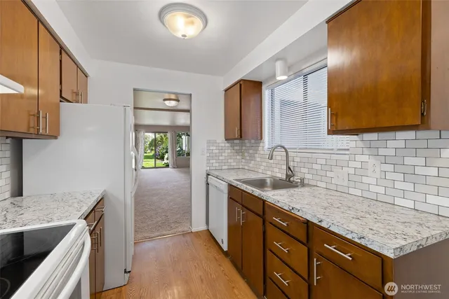 a kitchen with a sink and a stove