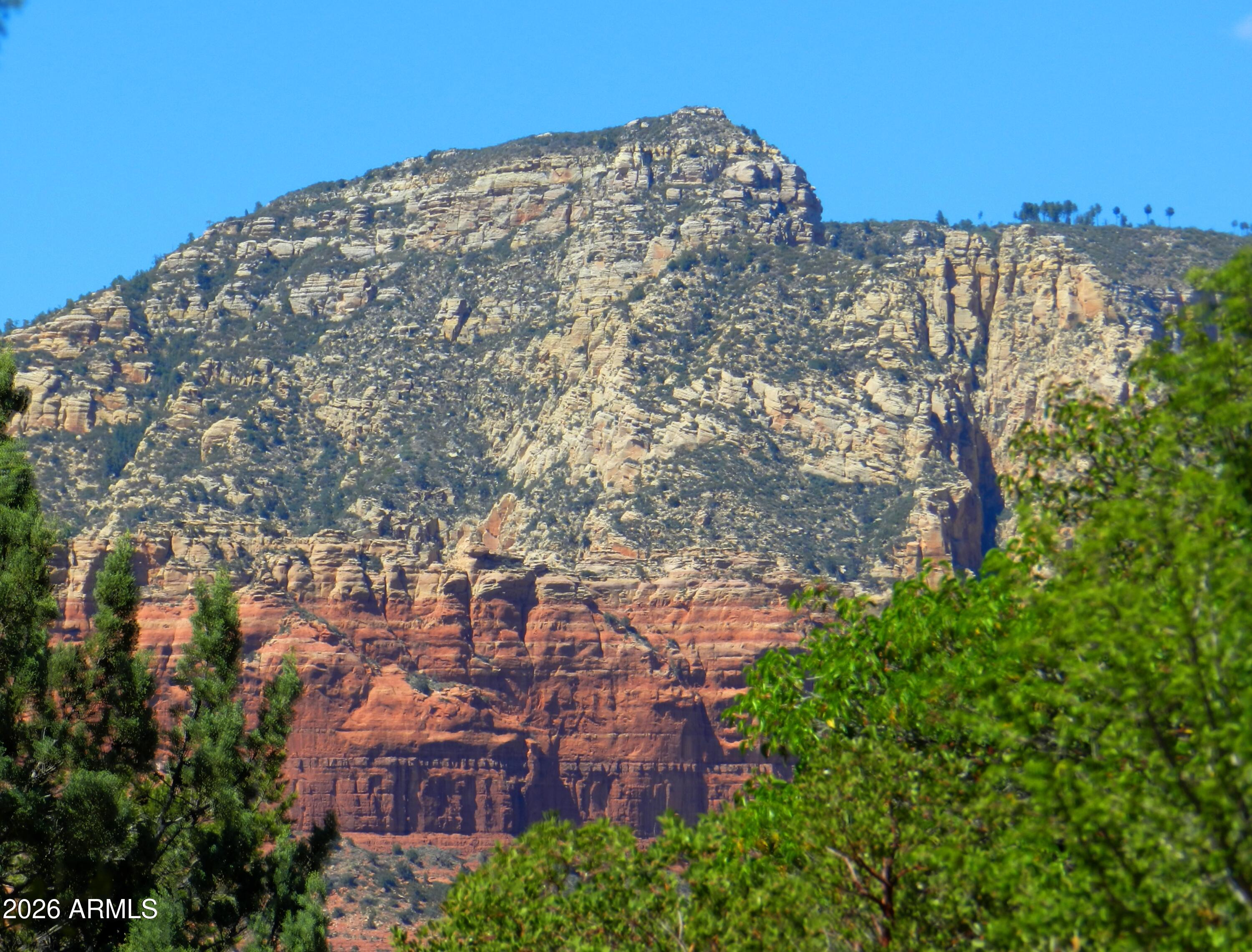 550 Barcelona Road Sedona, AZ 86336 - Photo 32 of 32 a view of a large building with a city view
