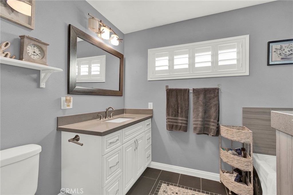 133 East Van Koevering Street Rialto, CA 92376 - Photo 11 of 23 a bathroom with a sink and a toilet