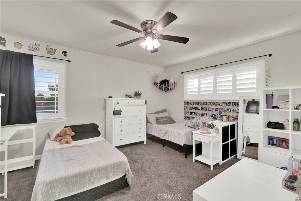 133 East Van Koevering Street Rialto, CA 92376 - Photo 15 of 23 a bedroom with bed and a large window