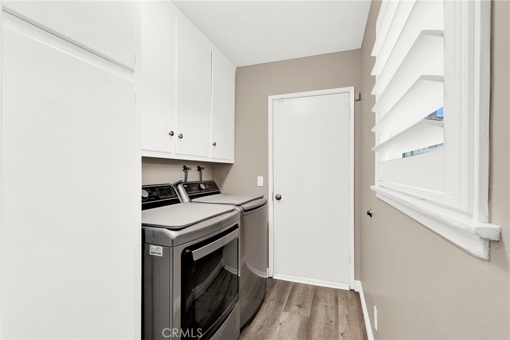 133 East Van Koevering Street Rialto, CA 92376 - Photo 18 of 23 a kitchen with a stove and a refrigerator